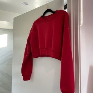 Red cropped sweater.